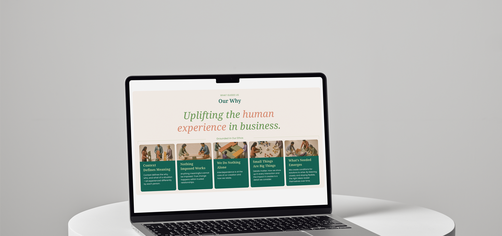 Laptop displaying Our Why and the Nikoleta & Associates ethos: uplifting the human experience in business.